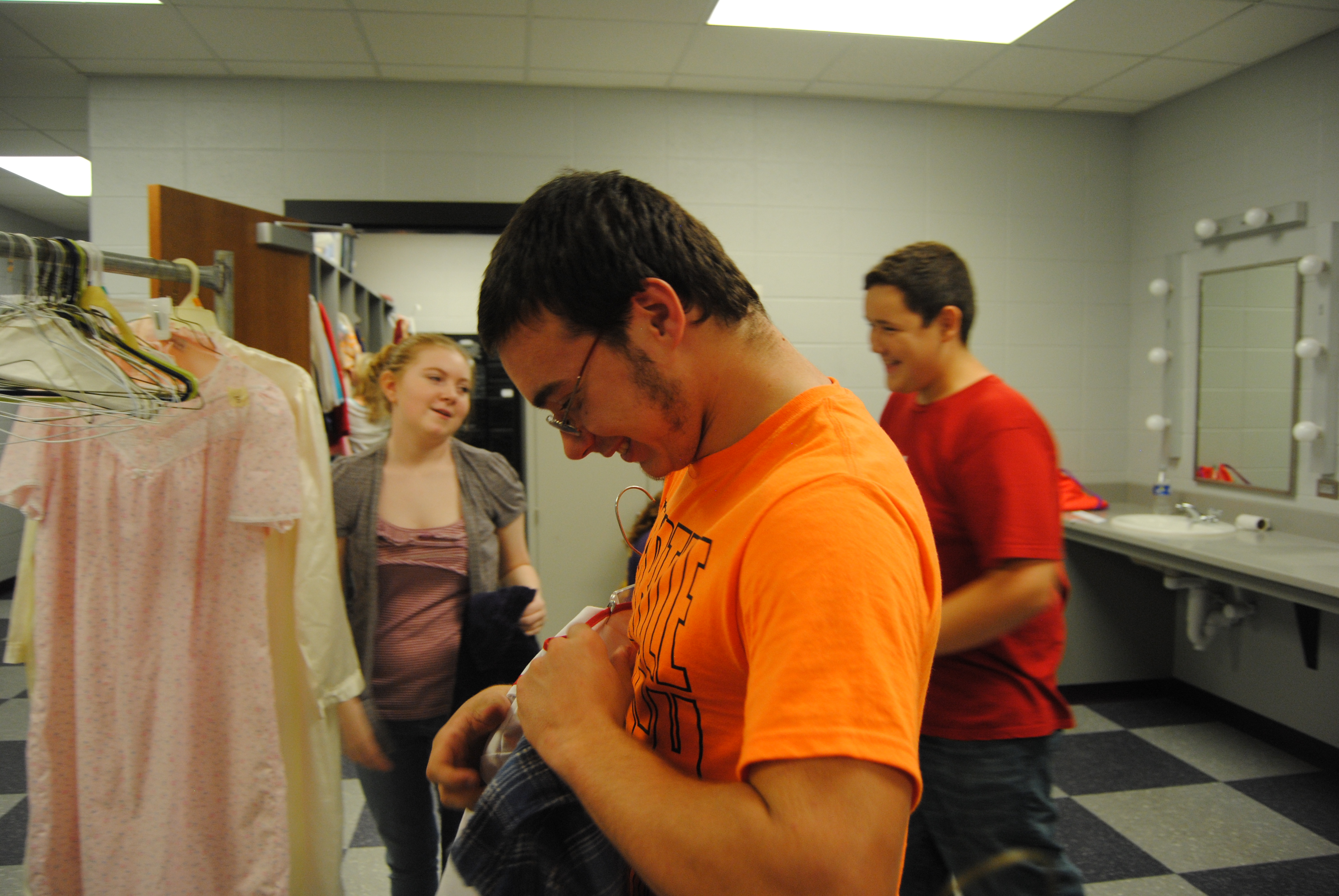 Sophomore Tyler Satterfield picks out his costume in theater class today.
