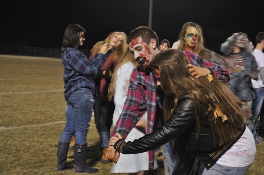 Freshman Keegan Anderson dances with another zombified participant.