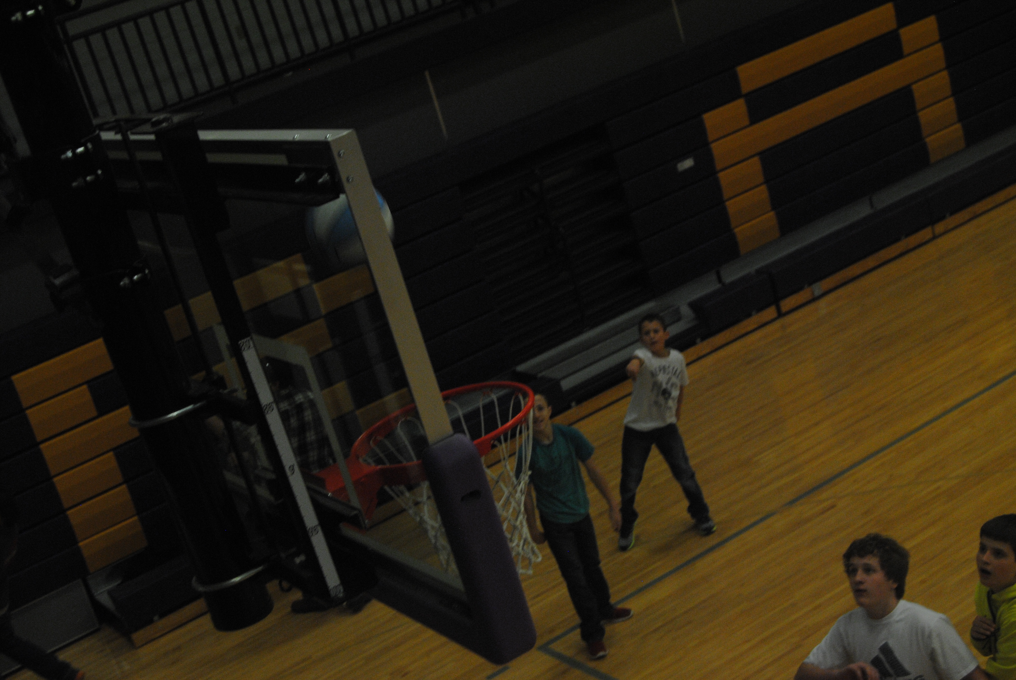 Seventh grader Wyatt Ashley shoots the ball in a game of basketball. This was during the Junior High recess that goes on after their lunch.