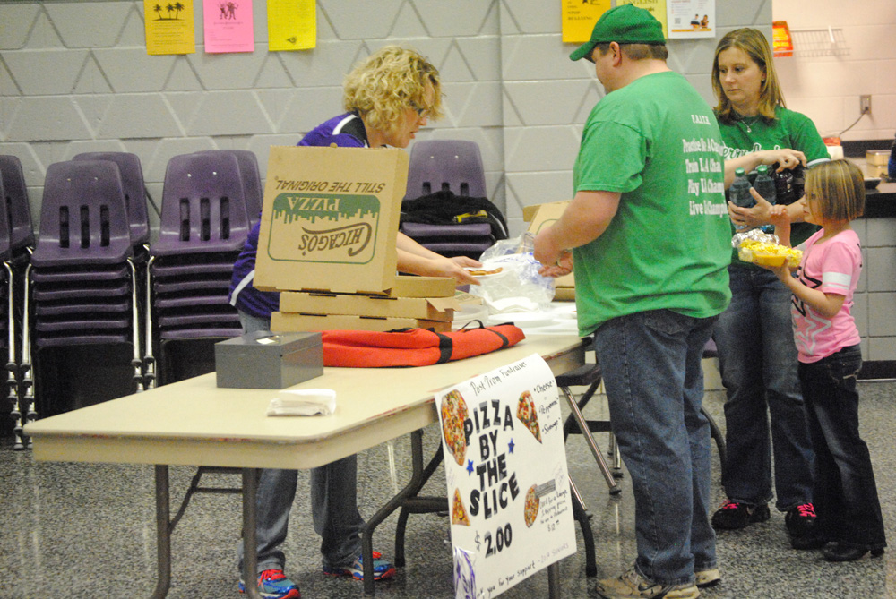 Staff Stacie Durbin sells Chicago’s Pizza during last Friday’s Boys Basketball game to raise money for prom. 