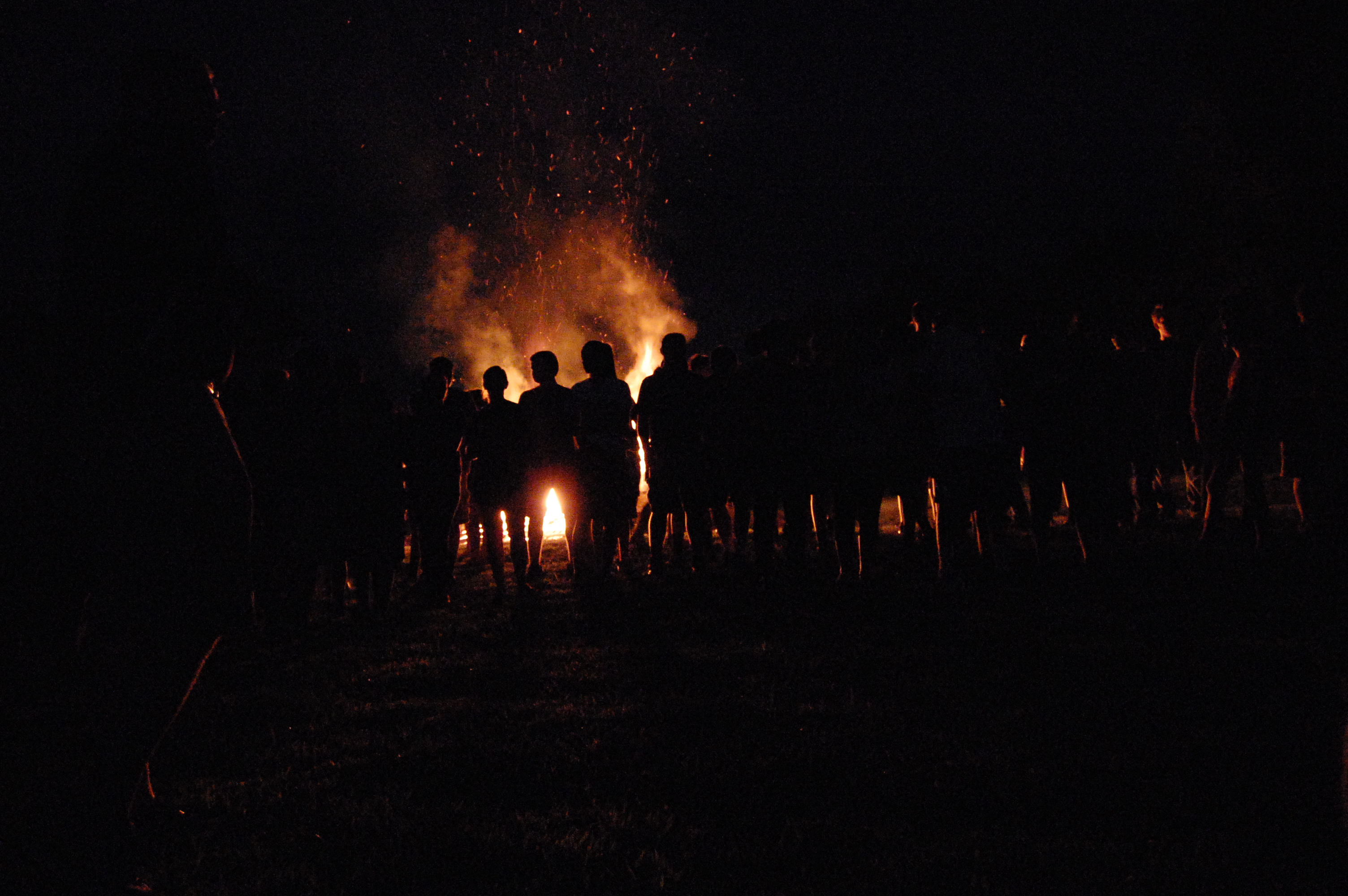 Students watching the bonfire and enjoying themselves. 